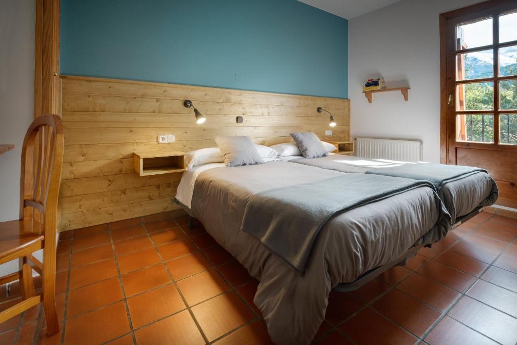 Postel nebo postele na pokoji v ubytování Hotel de Montaña Uson