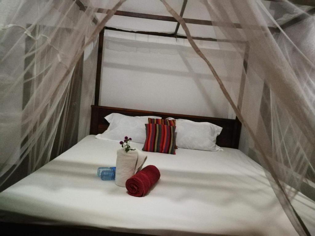 מיטה או מיטות בחדר ב-Canoe Beach House & Spa