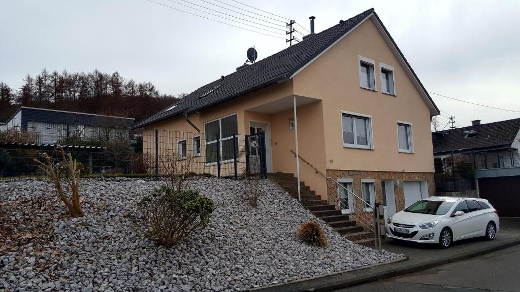 a white car parked in front of a house at Wolke Siegen in Siegen
