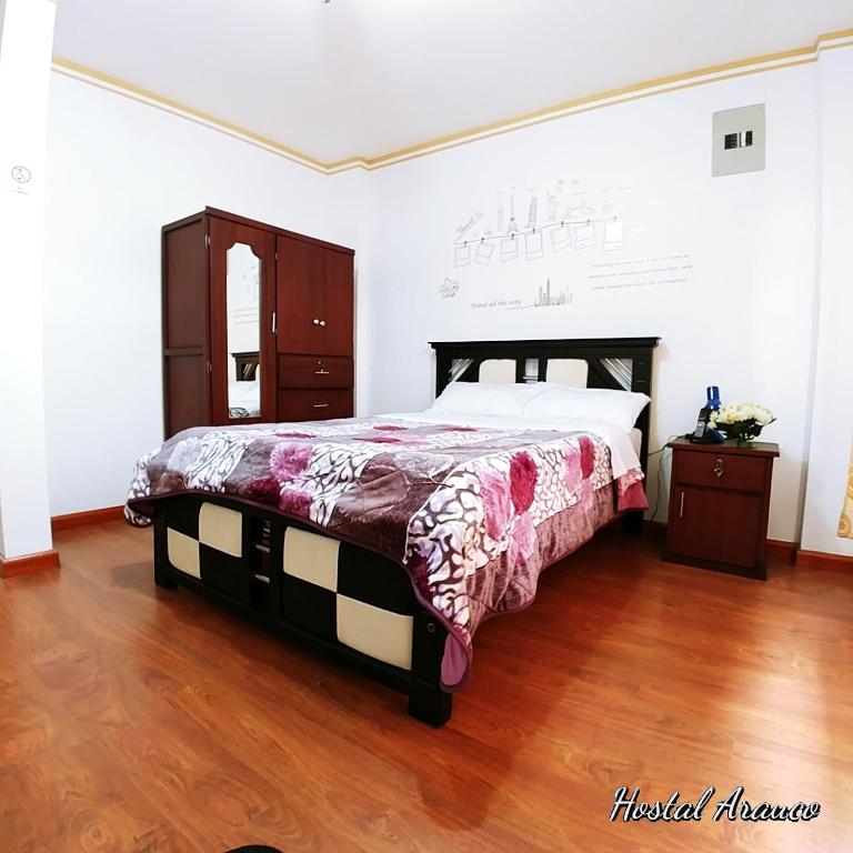 Postel nebo postele na pokoji v ubytování Hostal Arauco
