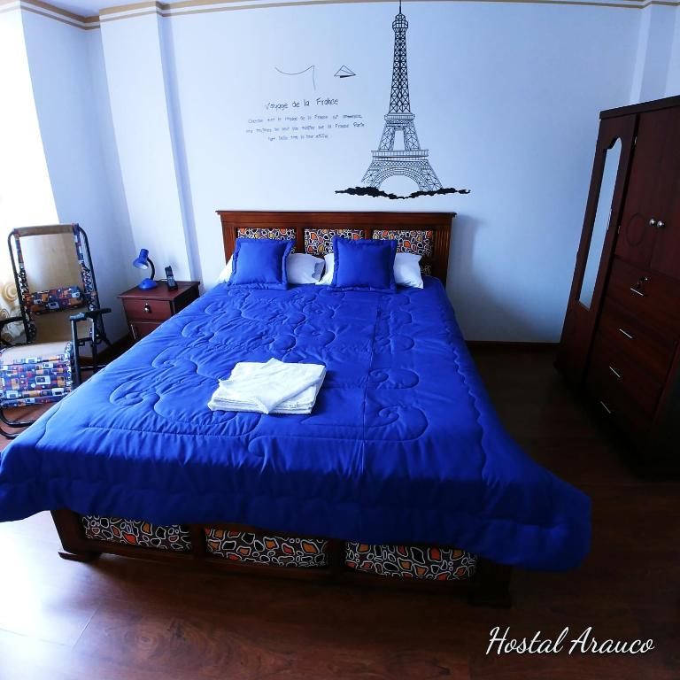 Postel nebo postele na pokoji v ubytování Hostal Arauco