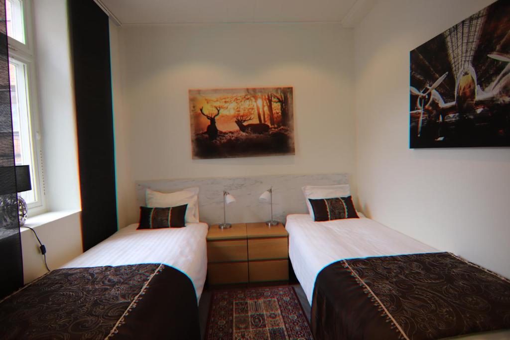 Postel nebo postele na pokoji v ubytování City HotelApartment