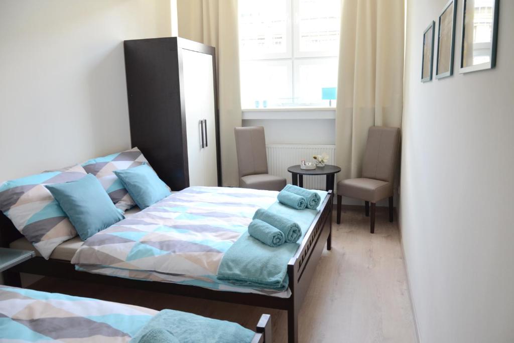 a bedroom with a bed and a desk at Hostel Bratislava in Bratislava