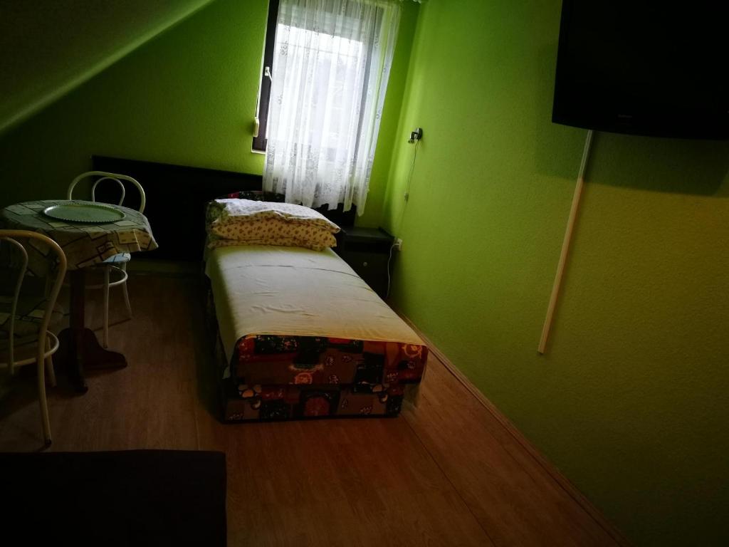 Postel nebo postele na pokoji v ubytování Páterdombi Vendégház
