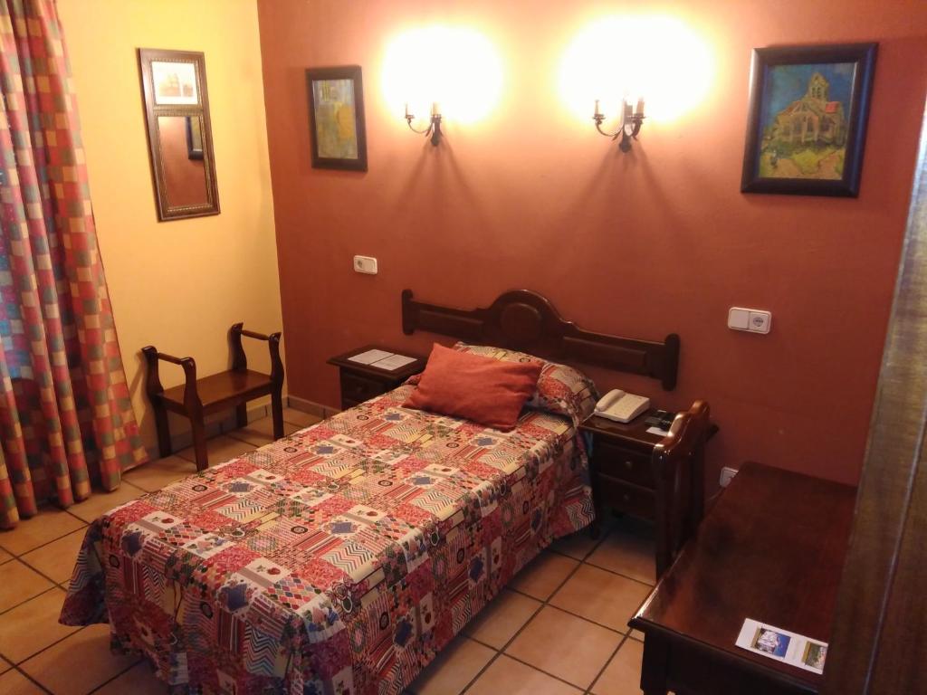 Postel nebo postele na pokoji v ubytování Hotel Riavela