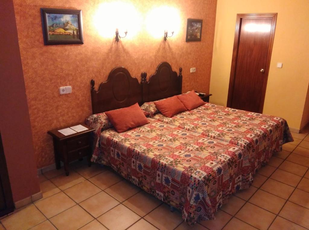 Postel nebo postele na pokoji v ubytování Hotel Riavela