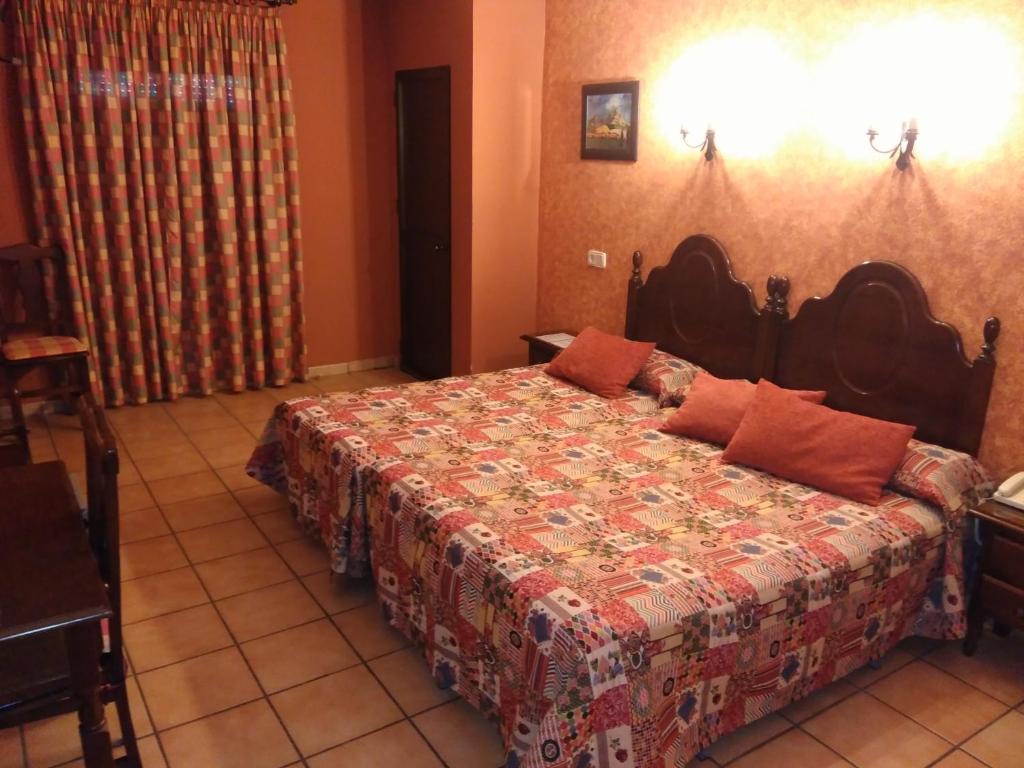 Postel nebo postele na pokoji v ubytování Hotel Riavela