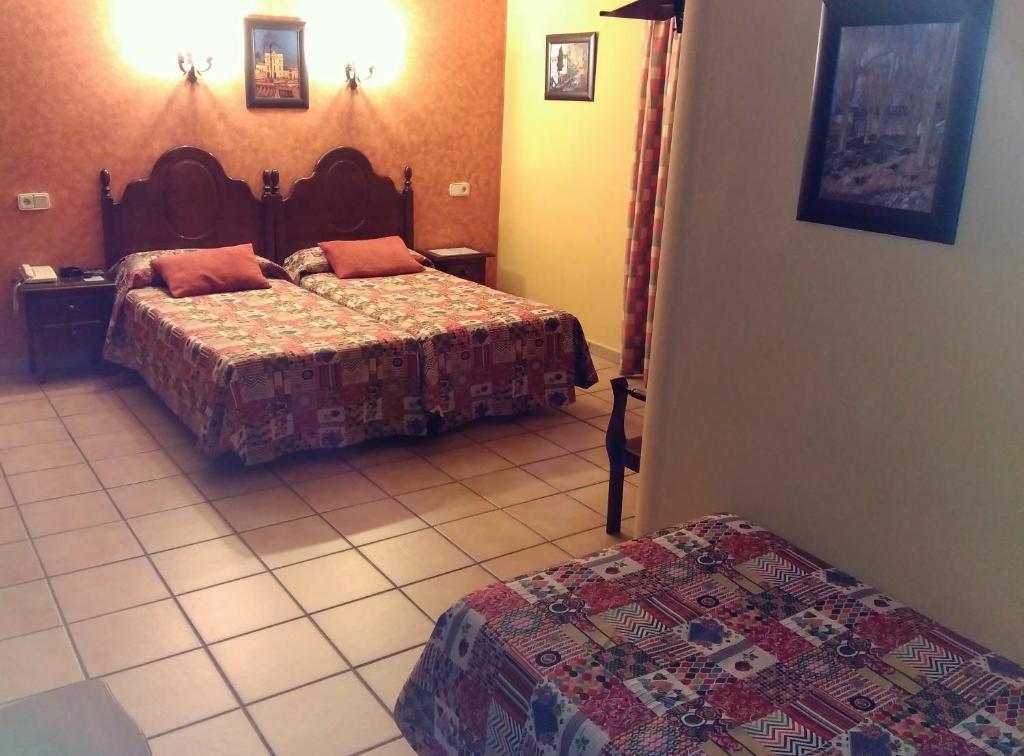 Postel nebo postele na pokoji v ubytování Hotel Riavela