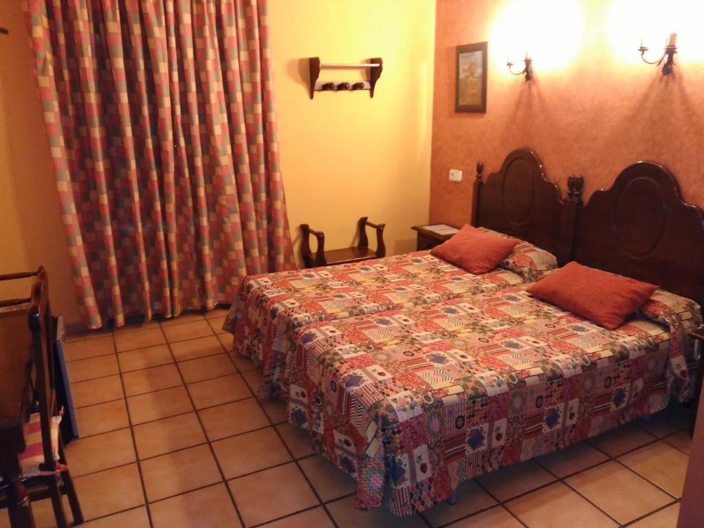 Postel nebo postele na pokoji v ubytování Hotel Riavela