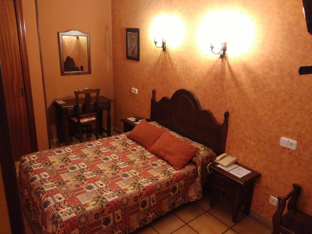 Postel nebo postele na pokoji v ubytování Hotel Riavela