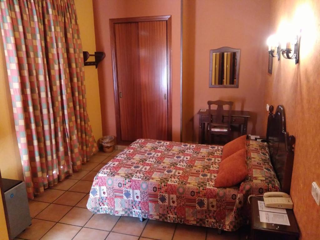 Postel nebo postele na pokoji v ubytování Hotel Riavela