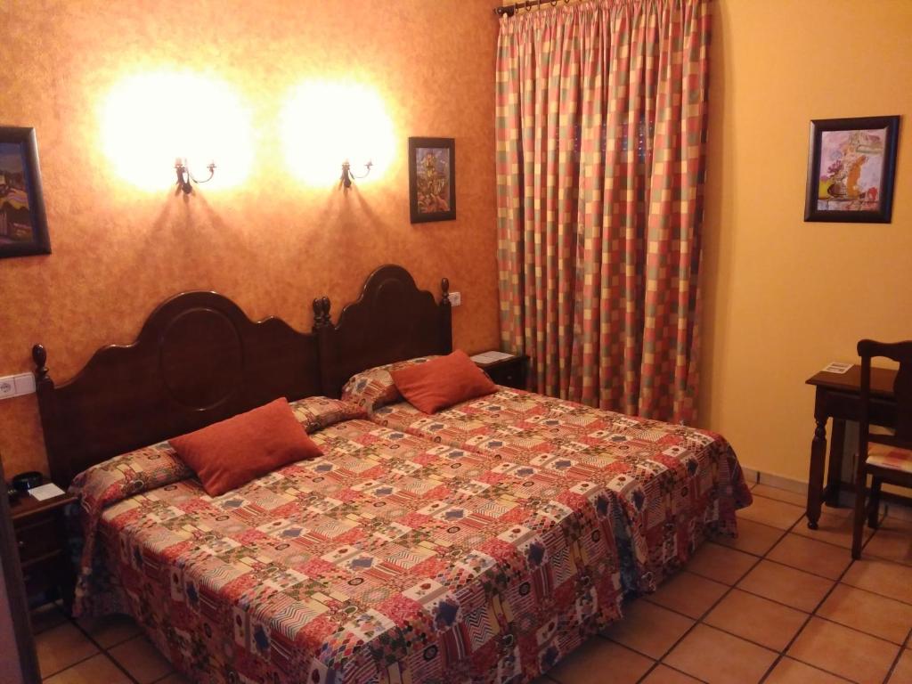Postel nebo postele na pokoji v ubytování Hotel Riavela