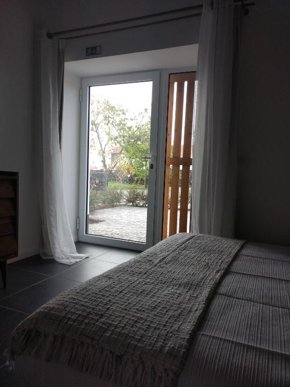Postel nebo postele na pokoji v ubytování Quinta das Giestas