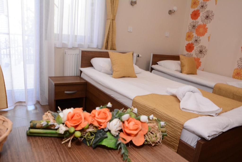 Postel nebo postele na pokoji v ubytování Garni Hotel Laguna Lux