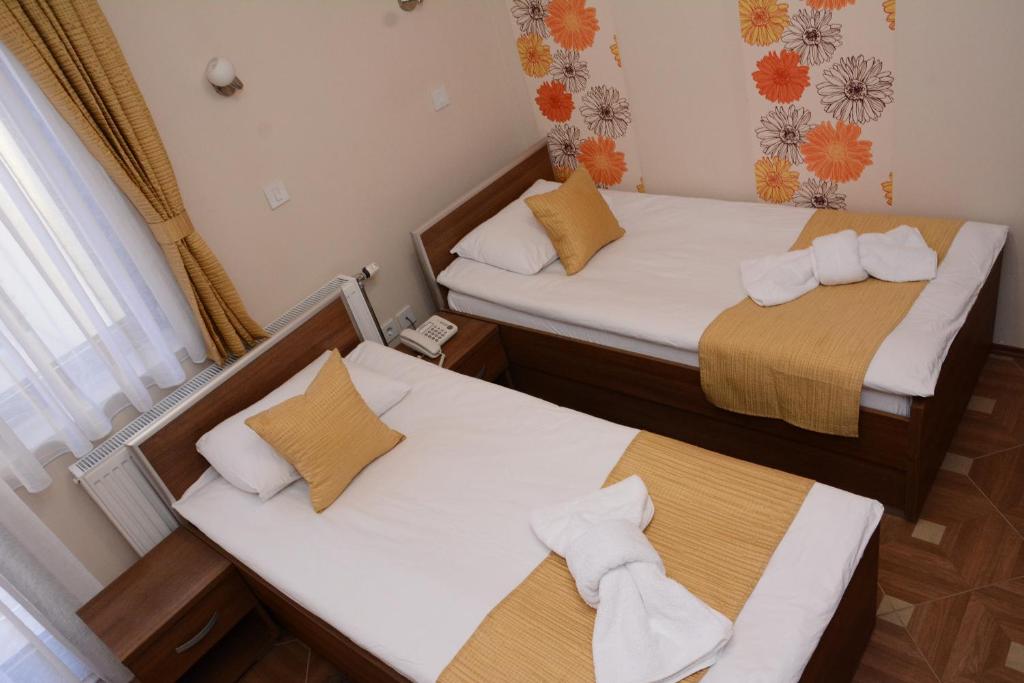 Postel nebo postele na pokoji v ubytování Garni Hotel Laguna Lux