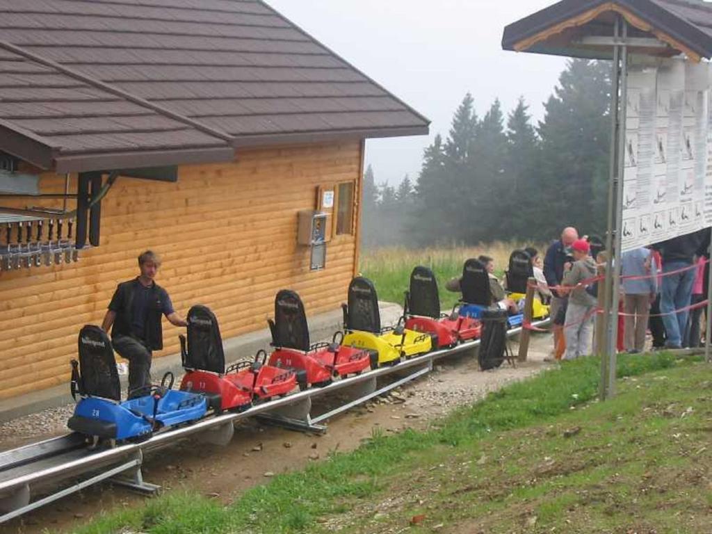 a row of kayaks lined up outside of a building at Rogla - Chalet Mojca Pokrajculja in Zreče