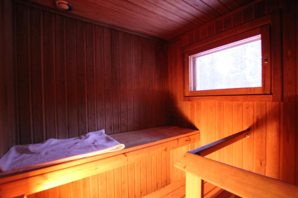 Postel nebo postele na pokoji v ubytování Ukonjärven Holiday Village