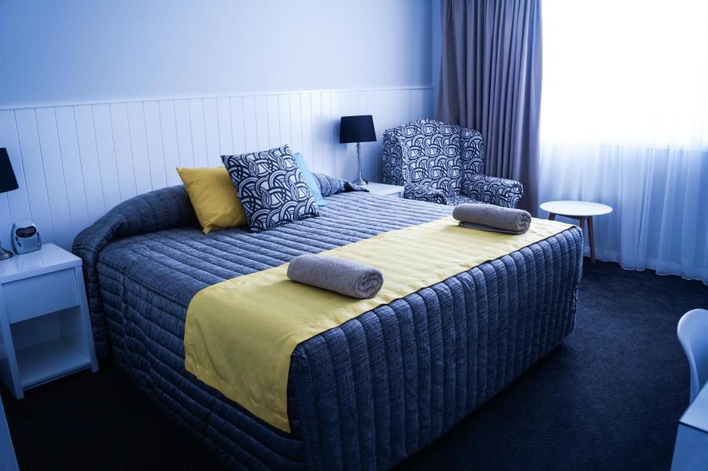Postel nebo postele na pokoji v ubytování Oasis Motel