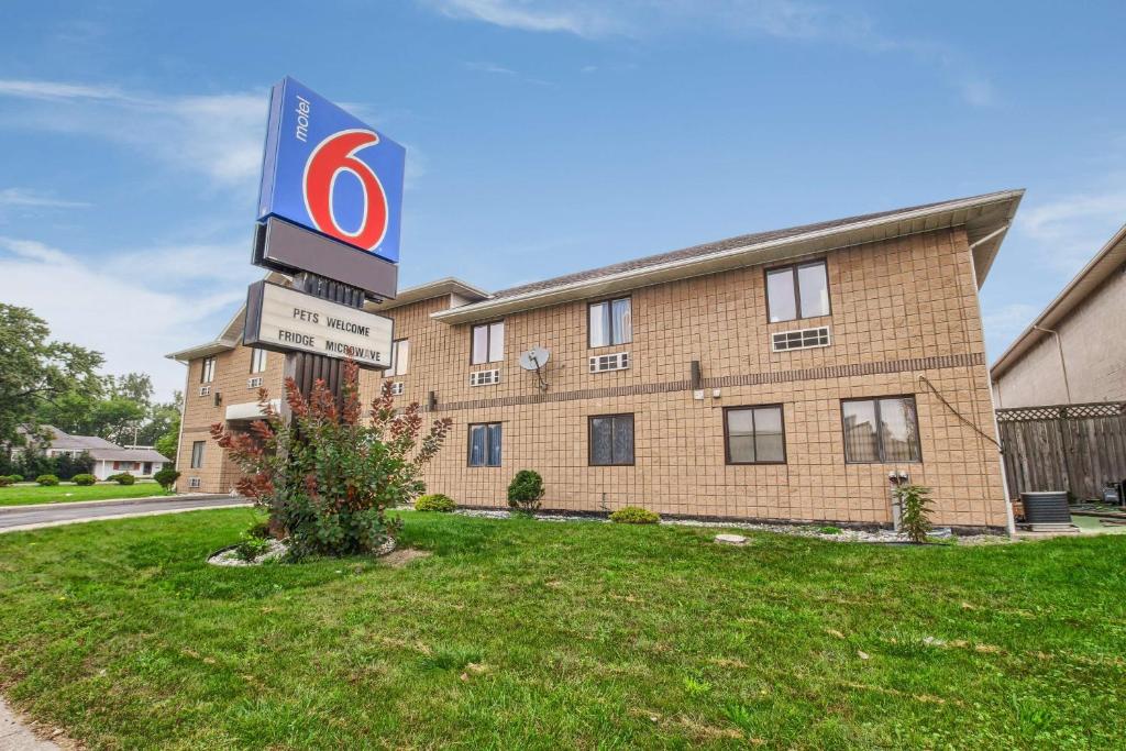 a building with a sign in front of it at Motel 6-Windsor, ON in Windsor