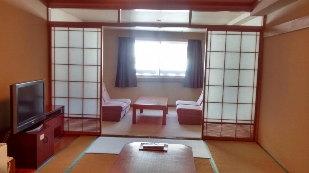 TV a/nebo společenská místnost v ubytování Shiga Palace Hotel