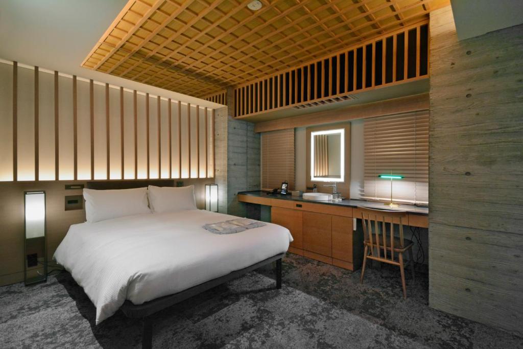 Postel nebo postele na pokoji v ubytování HOTEL HILLARYS Akasaka