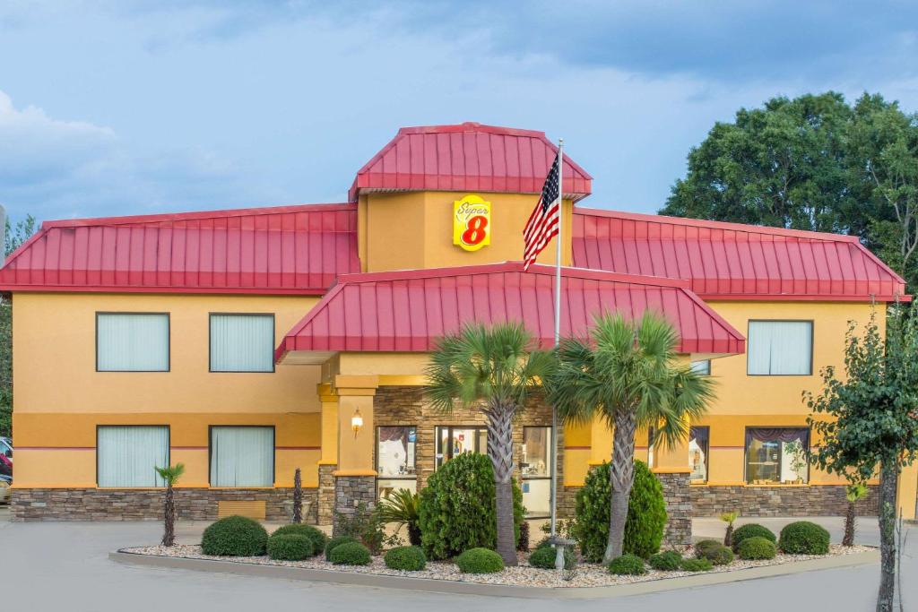 a fast food restaurant with a flag in front of it at Super 8 by Wyndham Dublin in Dublin