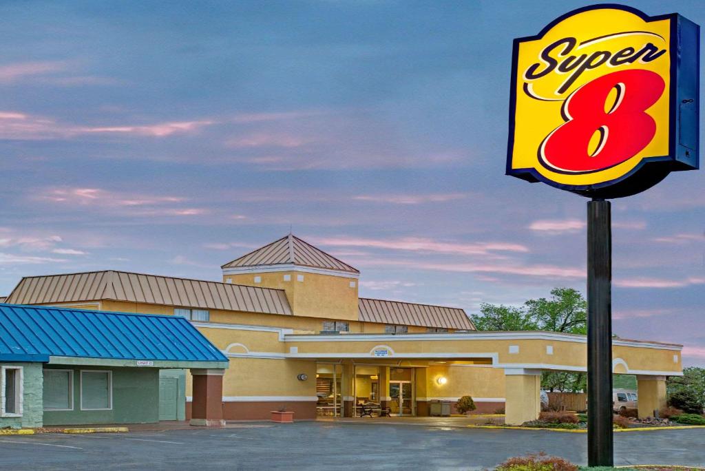 a sign in front of a super restaurant at Super 8 by Wyndham Wheat Ridge/Denver West in Wheat Ridge