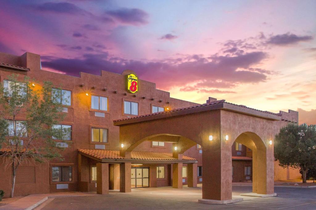 a rendering of a hotel at dusk at Super 8 by Wyndham Page/Lake Powell in Page