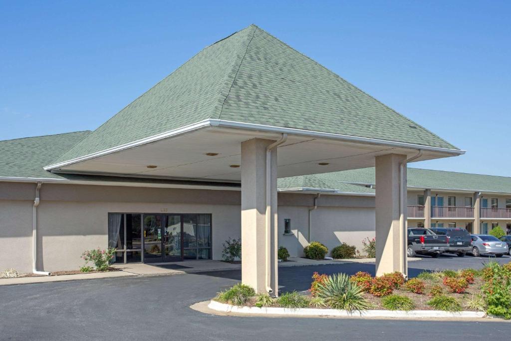 a building with a gazebo in a parking lot at Super 8 by Wyndham Dunn in Dunn