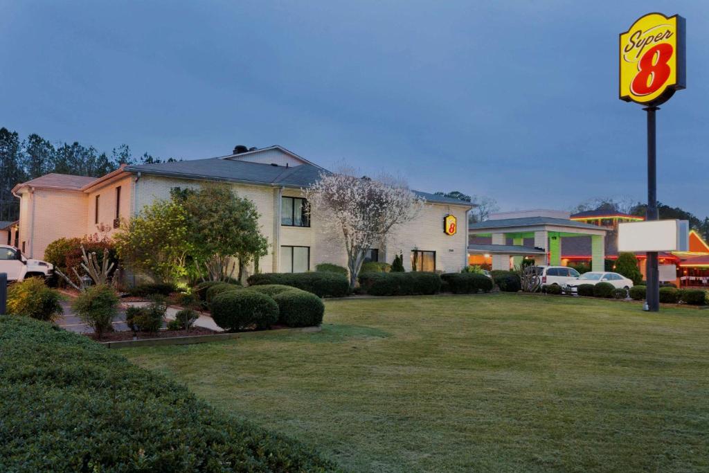 a fast food restaurant with a sign in a yard at Super 8 by Wyndham Lancaster in Lancaster