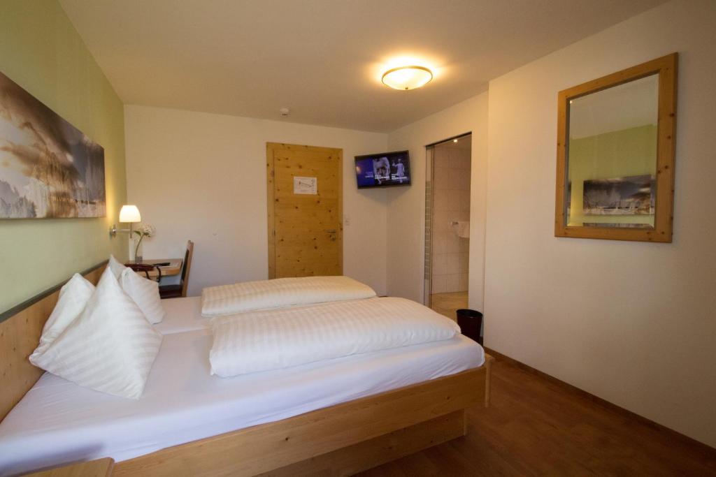Postel nebo postele na pokoji v ubytování Hotel Munde