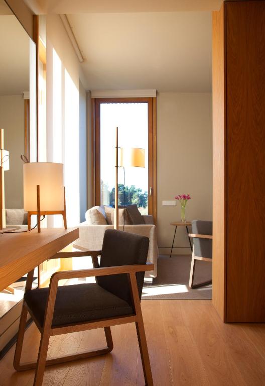 a living room with a couch and a table at Hotel Arima & Spa - Small Luxury Hotels in Donostia-San Sebastián