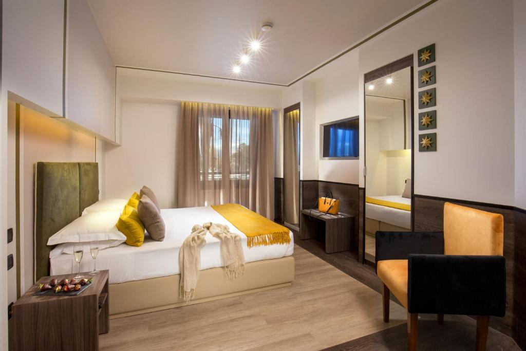 Postel nebo postele na pokoji v ubytování Hotel Domidea