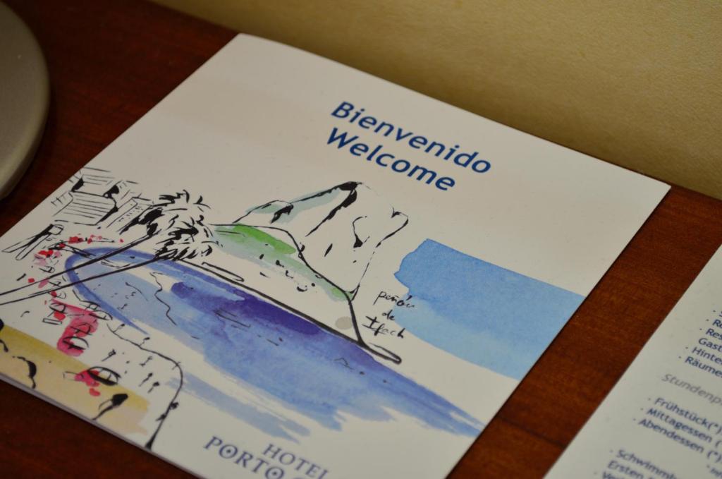 a book with a drawing of a mountain at Hotel Porto Calpe in Calpe