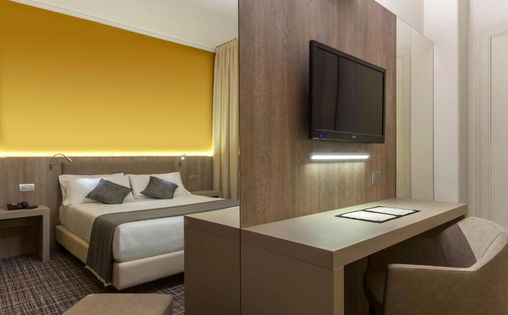 Postel nebo postele na pokoji v ubytování Living Hotel Milano