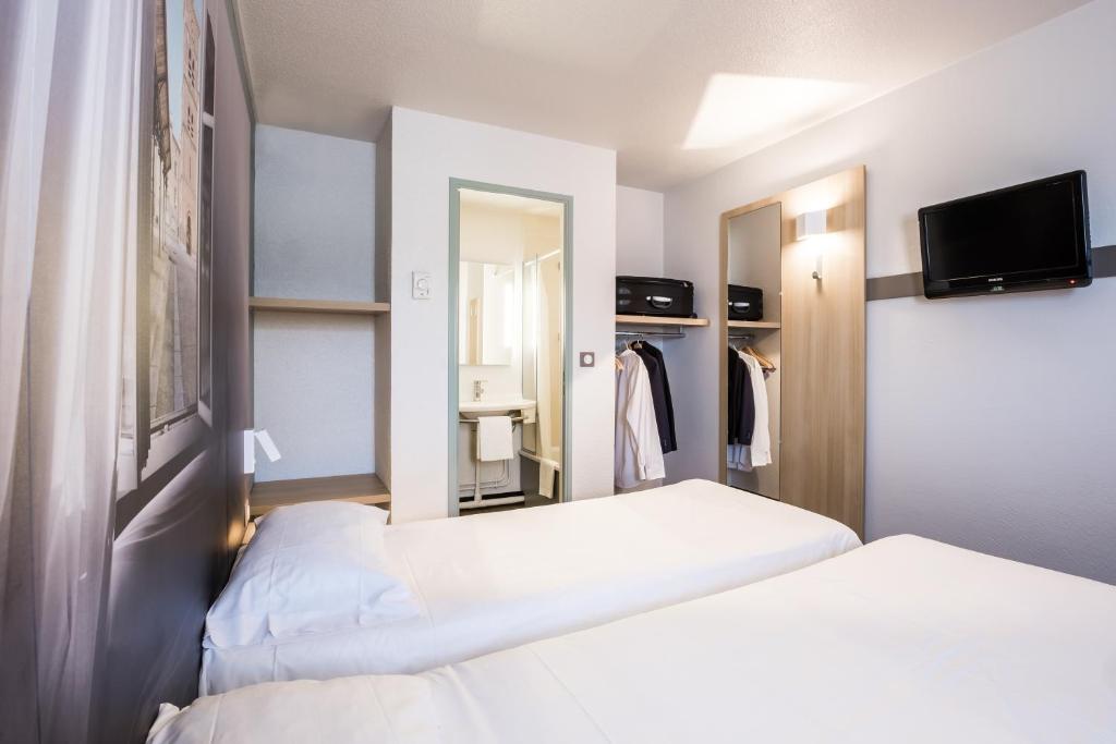 Postel nebo postele na pokoji v ubytování B&B HOTEL Brignoles