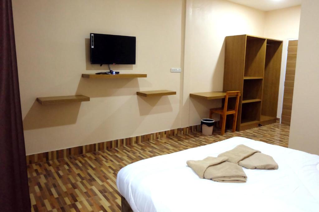 Postel nebo postele na pokoji v ubytování Banpong Center Place