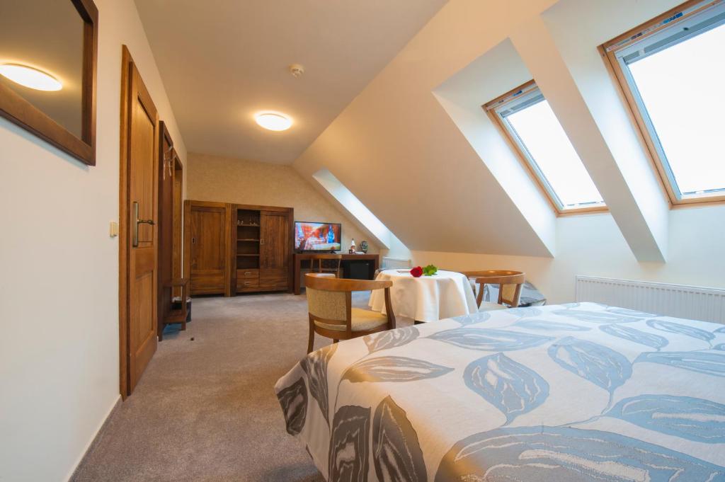 Postel nebo postele na pokoji v ubytování Hotel Mario