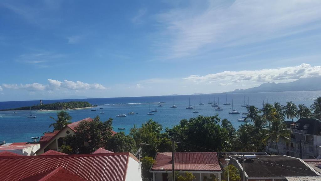 a view of a harbor with boats in the water at Résidence les 2 MONTOUT in Le Gosier