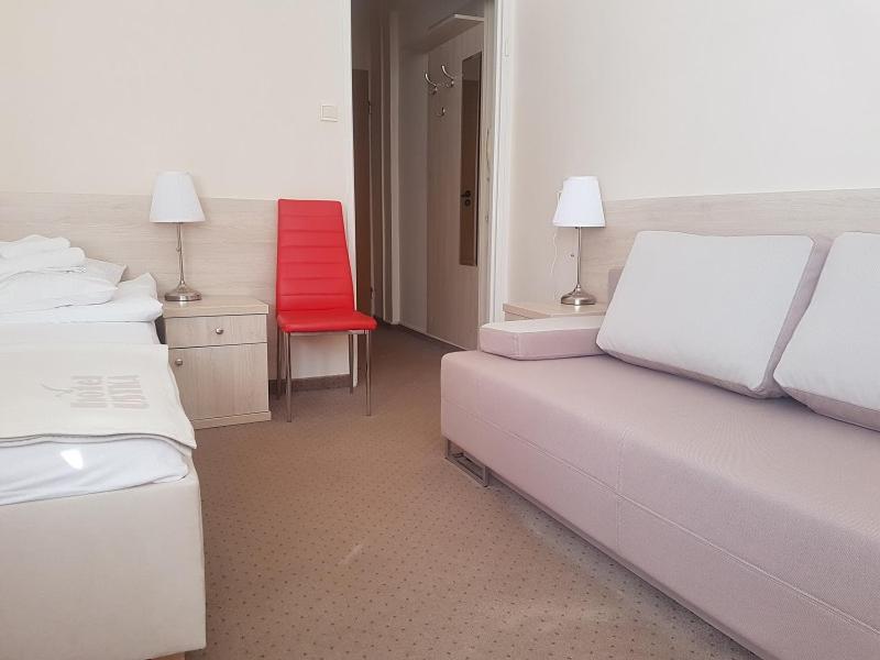 Postel nebo postele na pokoji v ubytování Hotel Ustka