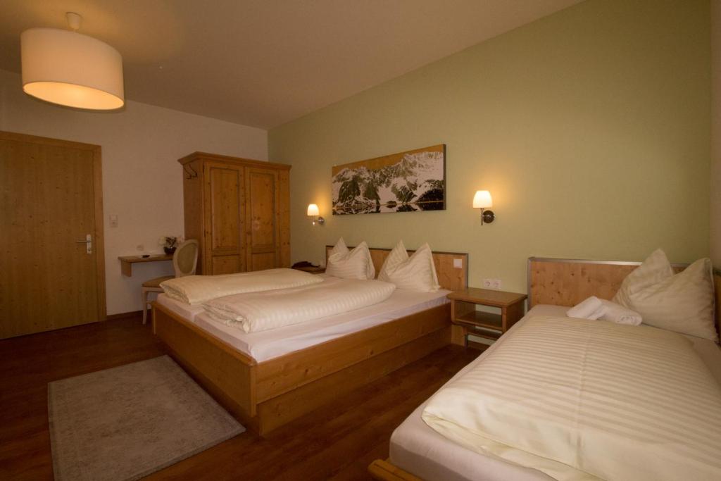 Postel nebo postele na pokoji v ubytování Hotel Munde