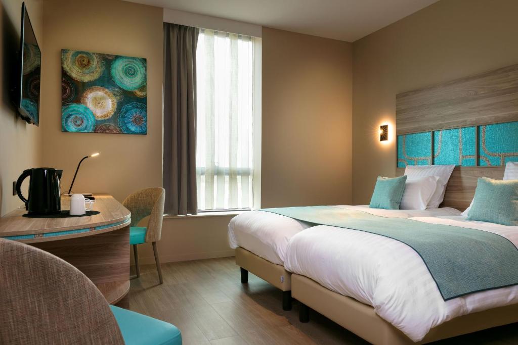 Postel nebo postele na pokoji v ubytování Best Western Plus Hôtel Escapade Senlis