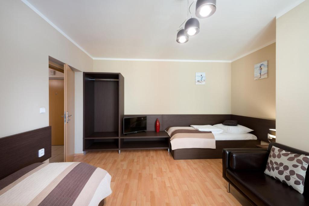 Postel nebo postele na pokoji v ubytování B2B Apartments