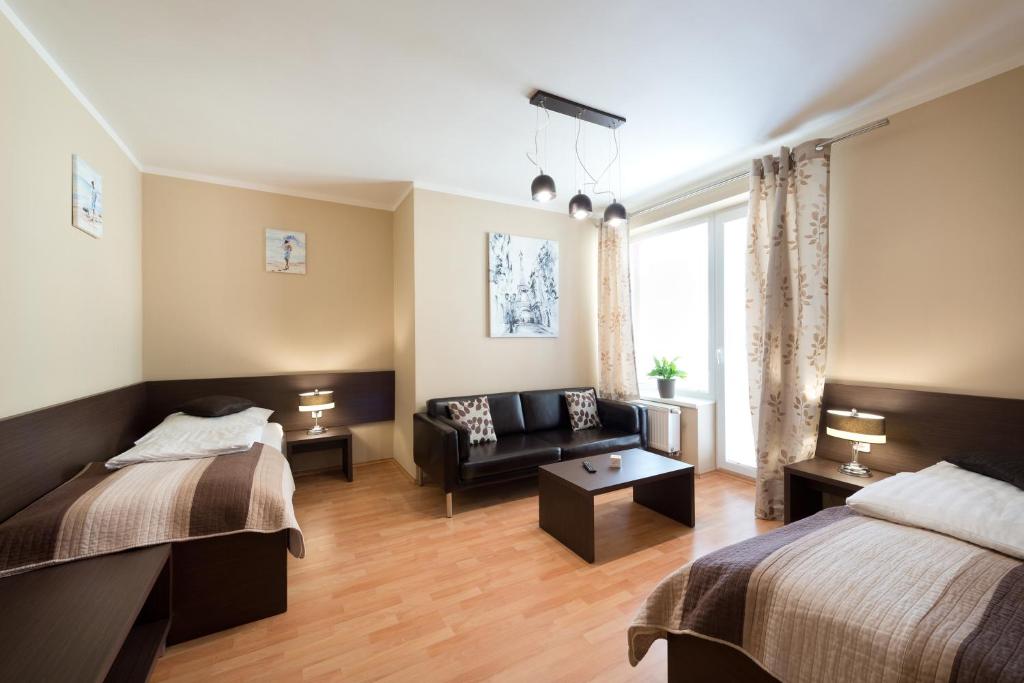 Postel nebo postele na pokoji v ubytování B2B Apartments