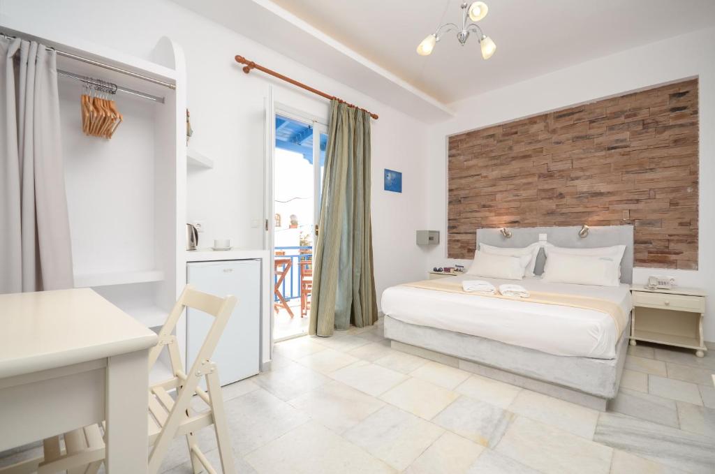 Postel nebo postele na pokoji v ubytování Dimitra Hotel