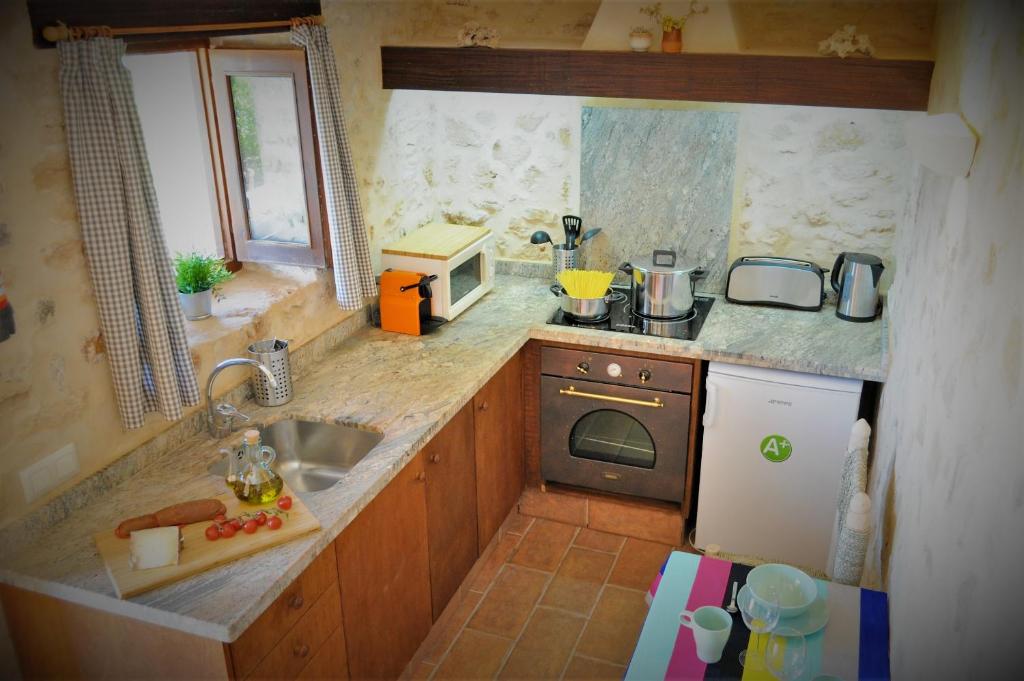 Kuchyň nebo kuchyňský kout v ubytování Siamoformentera Bella
