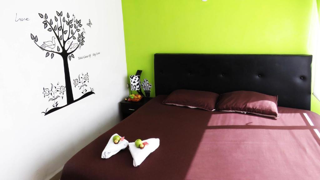 Postel nebo postele na pokoji v ubytování Hotel Bogota House