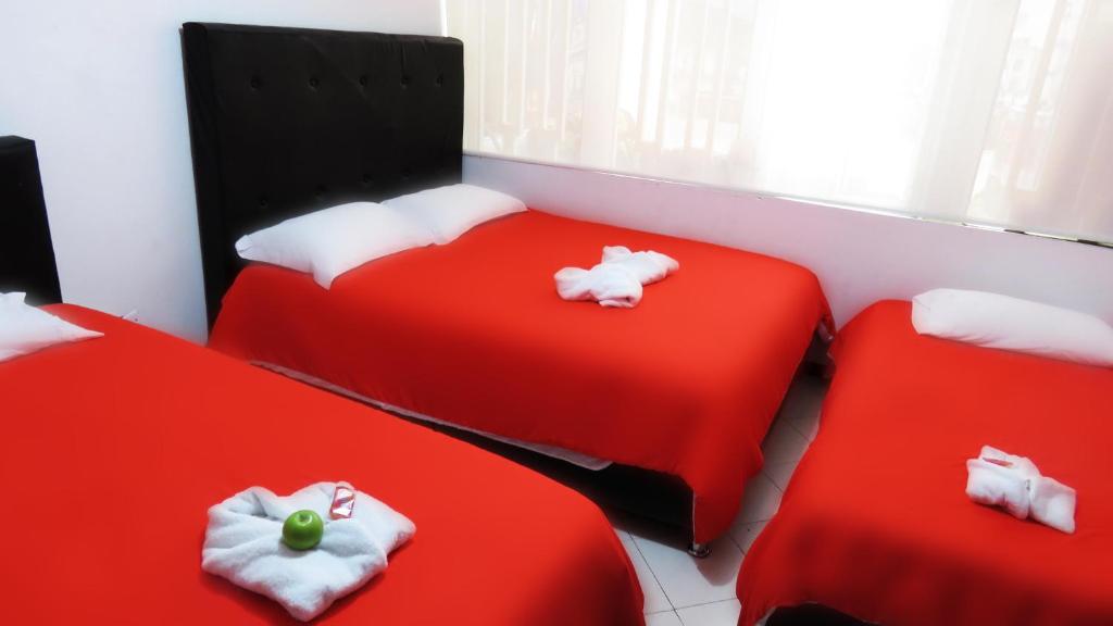 Postel nebo postele na pokoji v ubytování Hotel Bogota House