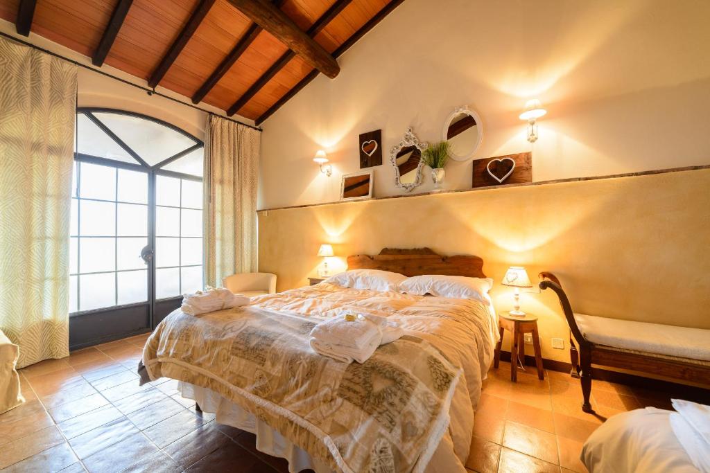 Postel nebo postele na pokoji v ubytování La Bandita Country Hotel