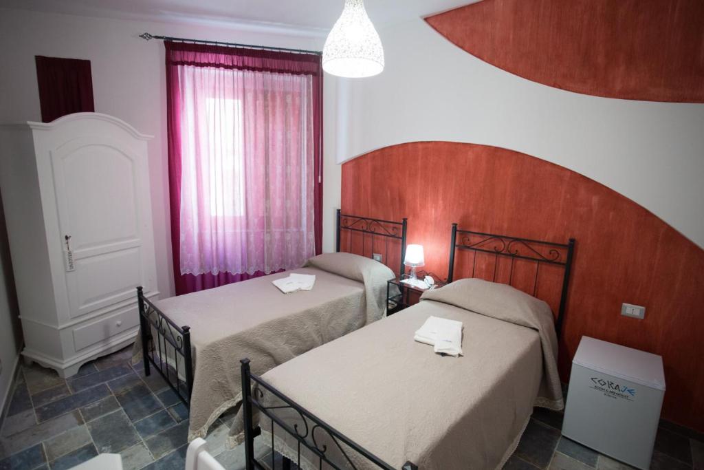 Posteľ alebo postele v izbe v ubytovaní Coraje Room & Breakfast